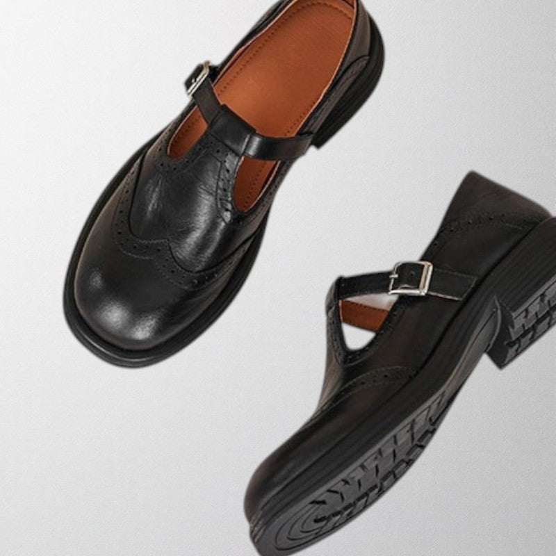 side view of black leather shoe with clasp women