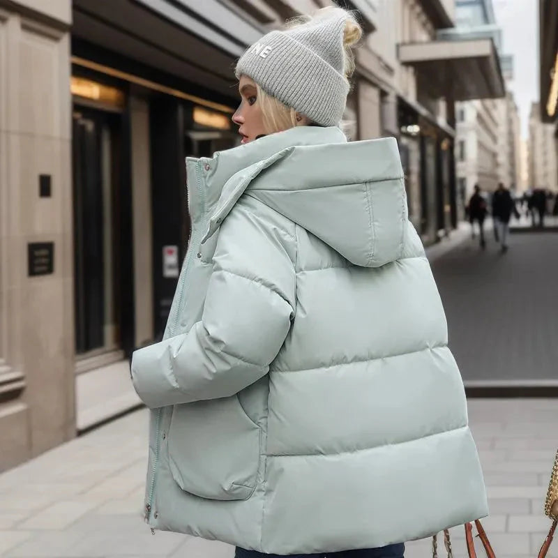 back view of mint green women’s padded waterproof winter coat