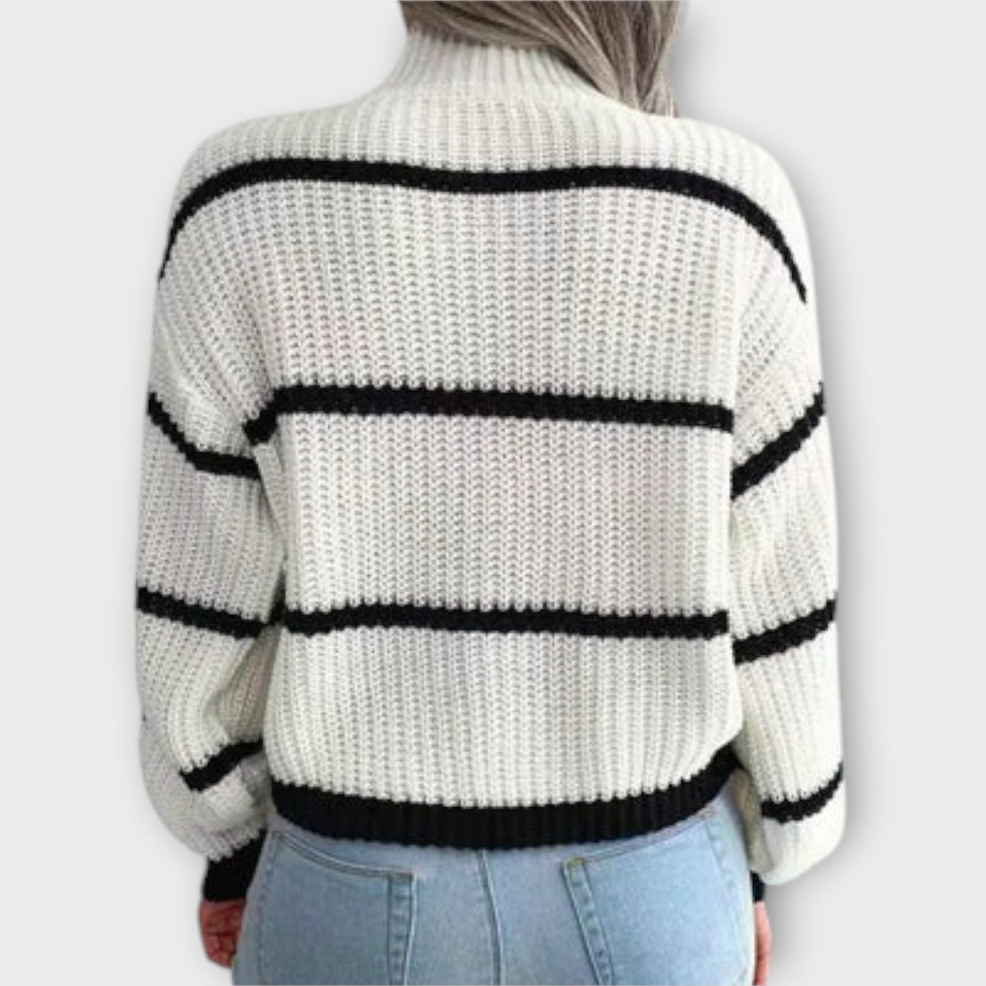 back view of white women’s turtleneck sweater with stripes
