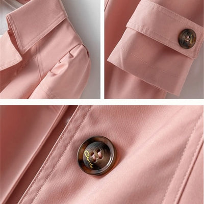 close-up detail of pink women’s classic waterproof trenchcoat