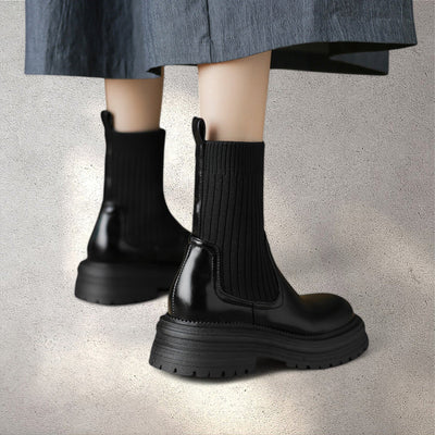 back view of black leather knit boots women