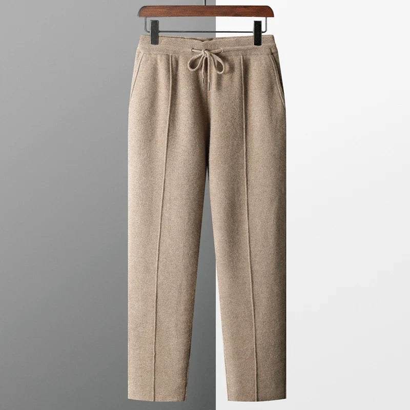 camel mens cashmere trousers hanging on display