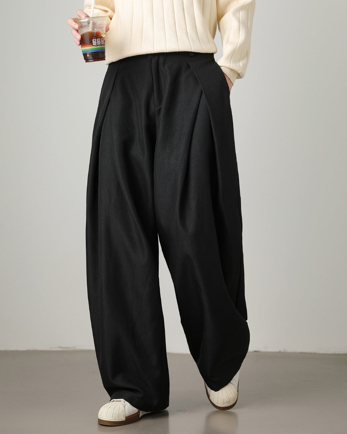 black men’s wide-leg pleated trousers pose