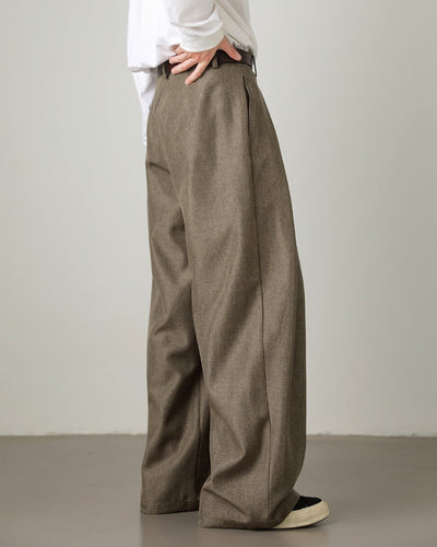 side view of brown men’s wide-leg pleated trousers