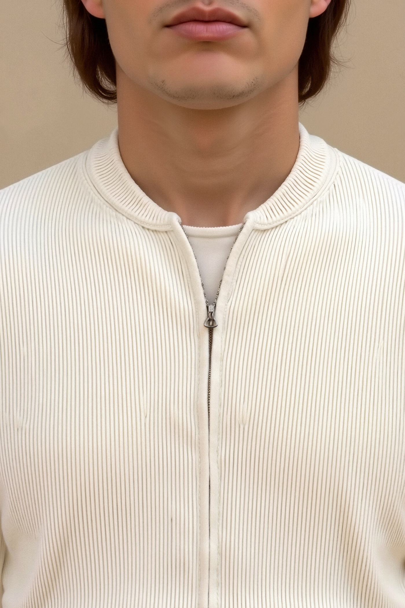 close-up detail of solid knitted crew neck cardigan