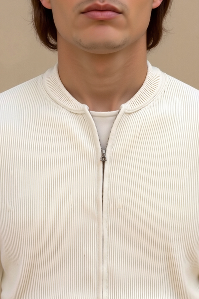 close-up detail of solid knitted crew neck cardigan