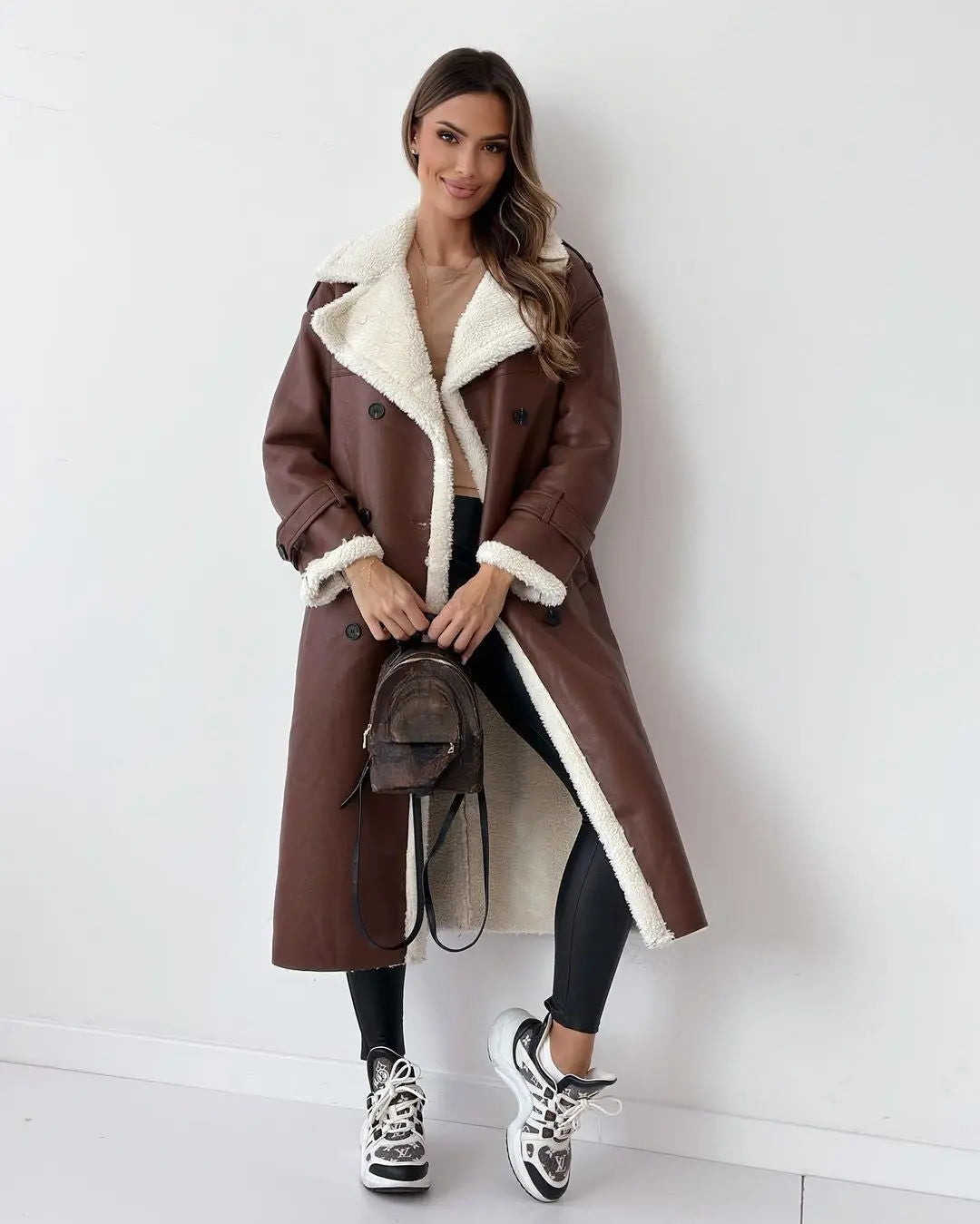 posed view of brown teddy trench coat women