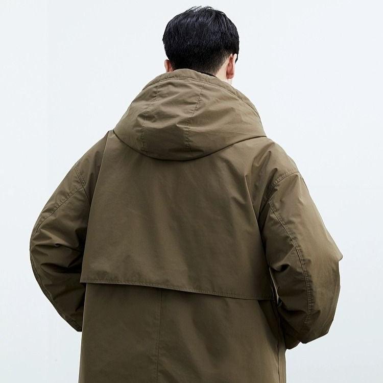 back view of army green water-resistant overcoat men