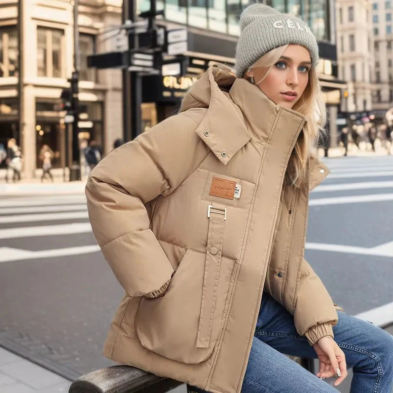 sitting view of khaki women’s padded waterproof winter coat