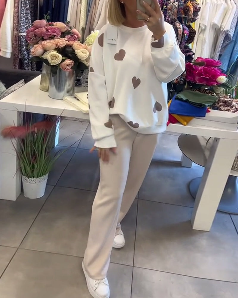 white women’s sweater with heart detail different pose