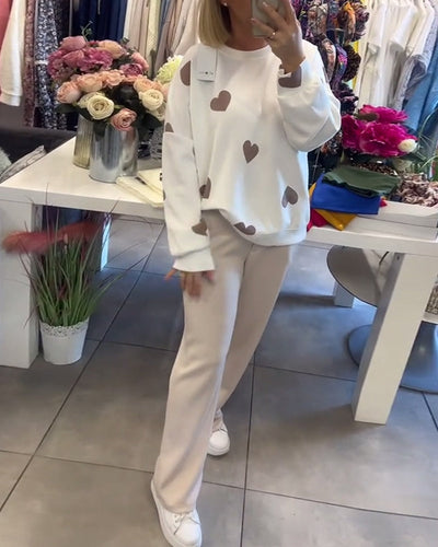 white women’s sweater with heart detail different pose