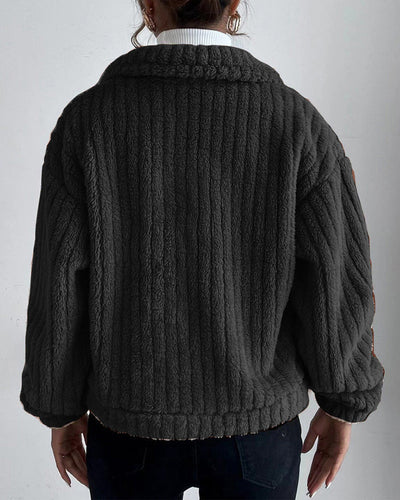 back view of black women’s teddy coat